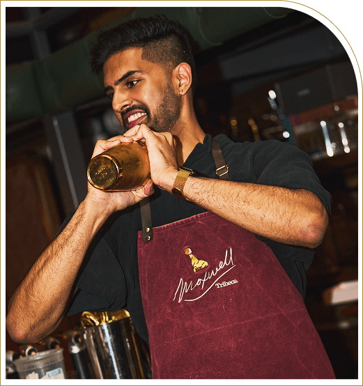 A chef from The Sewing Tin preparing a drink